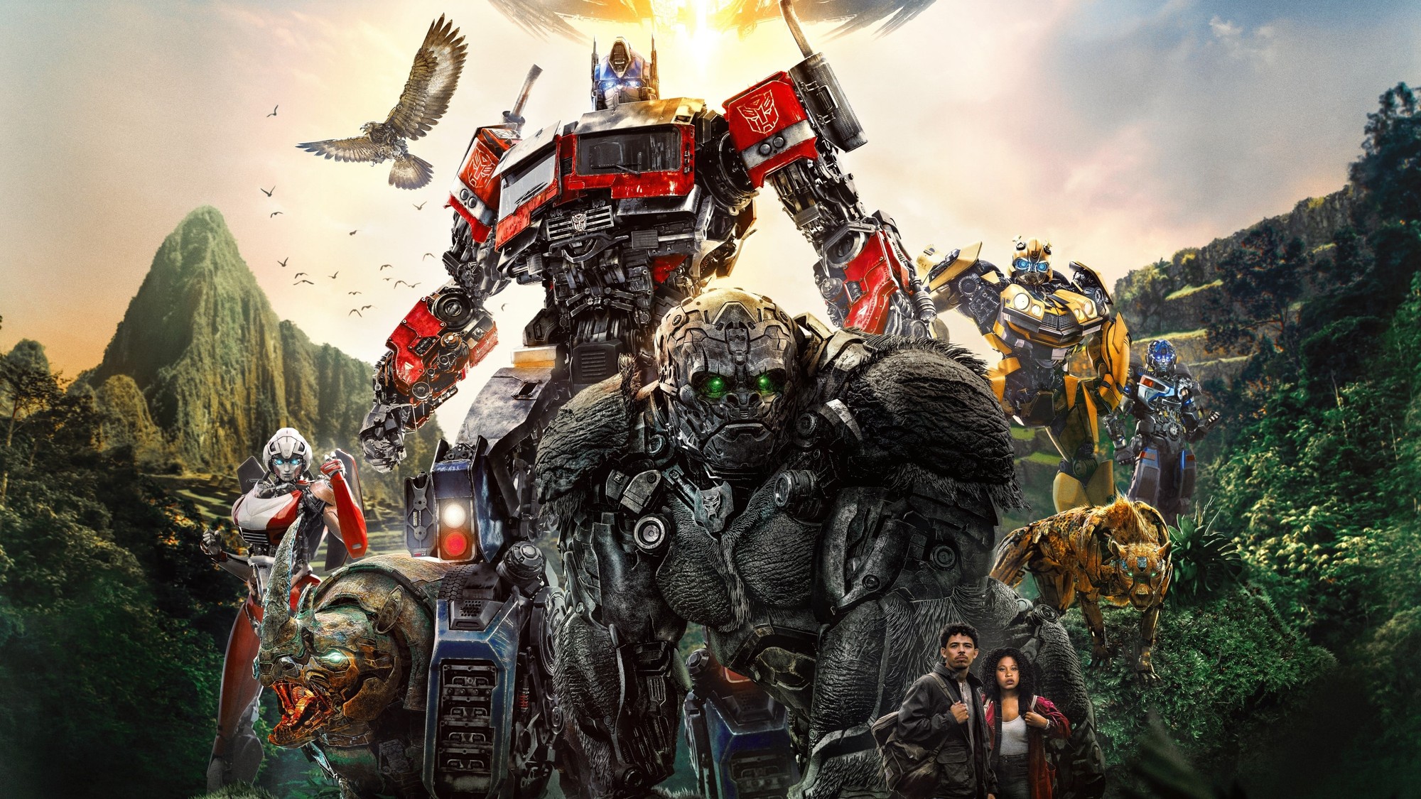 Optimus Prime junto a los Maximals y el resto de los Autobots en un paisaje selvático de Rise of the Beasts